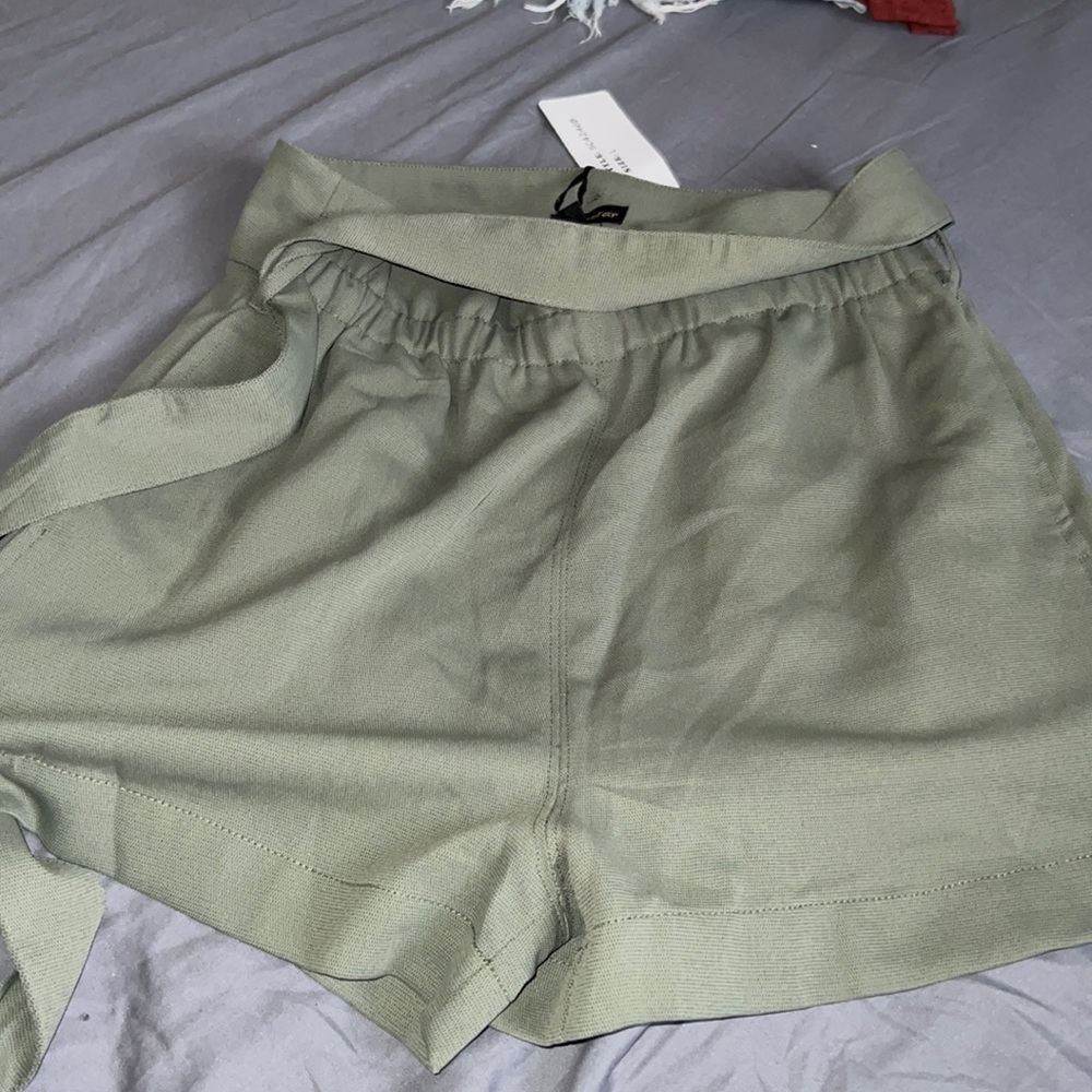 Green shorts with tag